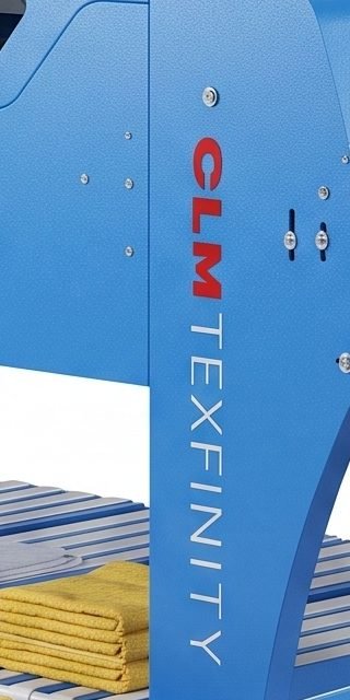 CLM Texfinity branding on the towel folder chassis